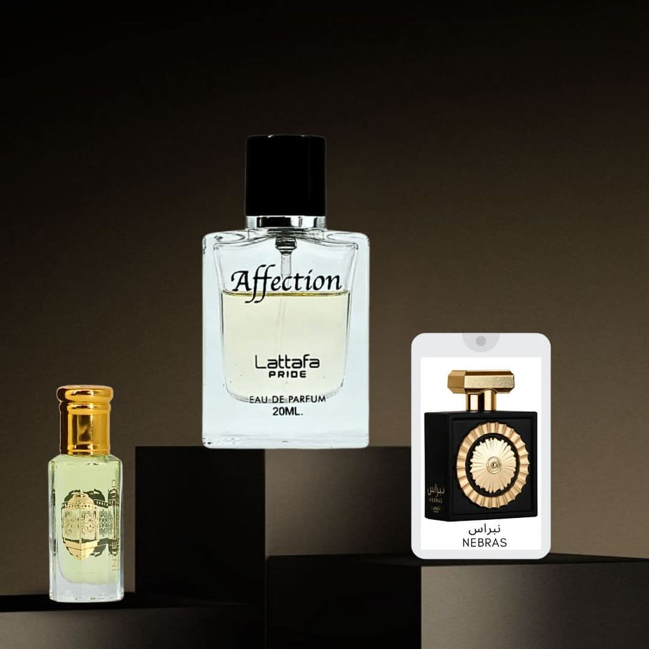 Intense Oud gift set featuring Nebras & Affection Eau de Parfum sprays and Lady Mile perfume oil in a magnetic box.