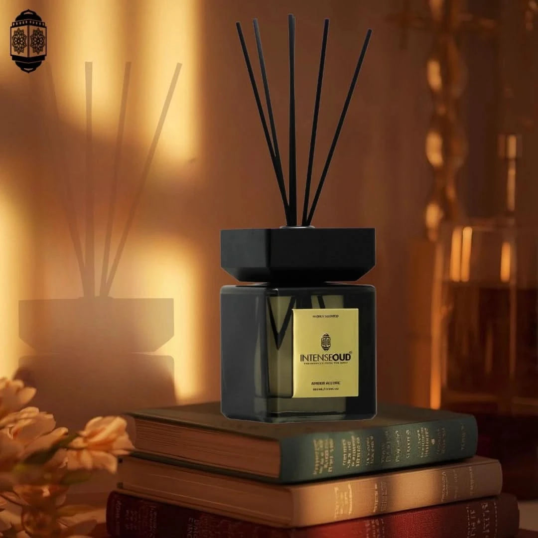 Intense Oud Amber Allure reed diffuser with 6 natural reed sticks in a refillable glass holder, lasting up to 90 days.