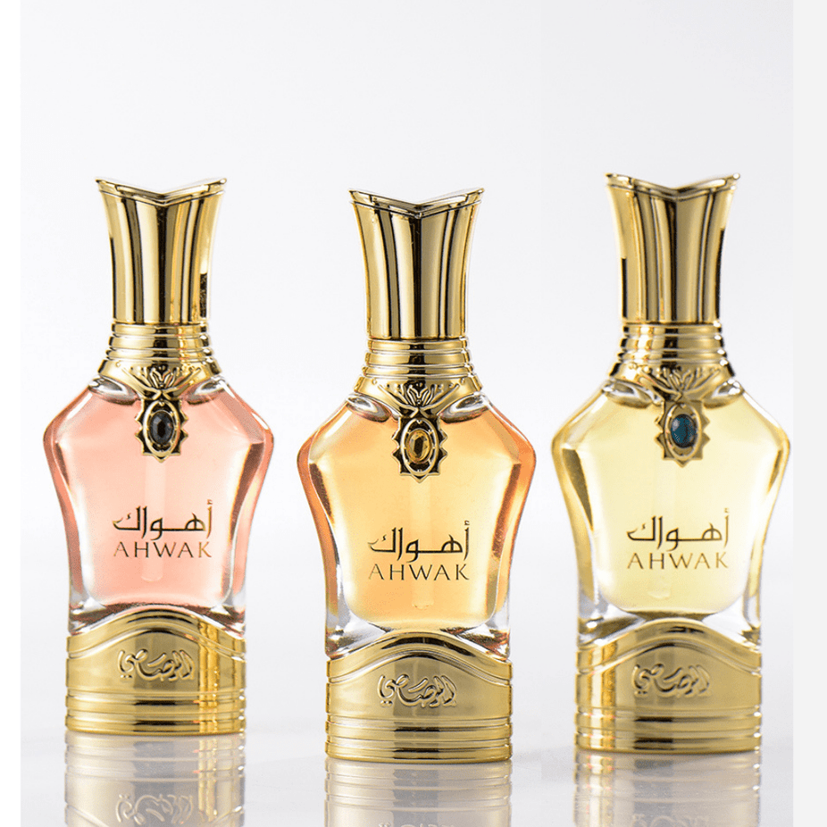 Rasasi Ahwak Al Asfar concentrated perfume oil in a 15ml bottle, with elegant packaging and golden accents.