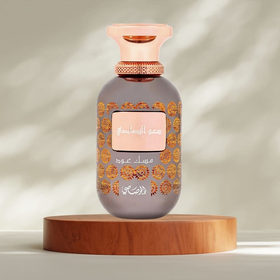 Rasasi Somow Al Rasasi Musk Oud Eau de Parfum spray bottle, 100ml, with elegant packaging and fragrance details visible.