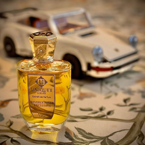 Beverly Hills Exclusive Extrait de Parfum 100ml by Unique'e Luxury, featuring elegant perfume bottle and luxurious packaging.