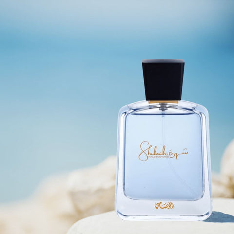 Bundle of Rasasi Hawas Ice, Daarej, and Shuhrah for Men Eau de Parfum sprays, featuring sleek bottles with elegant labels.