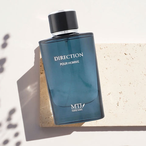 Direction Pour Homme EDP spray by MTJ, 100ML, featuring a luxurious floral and woody masculine scent in a sleek bottle.