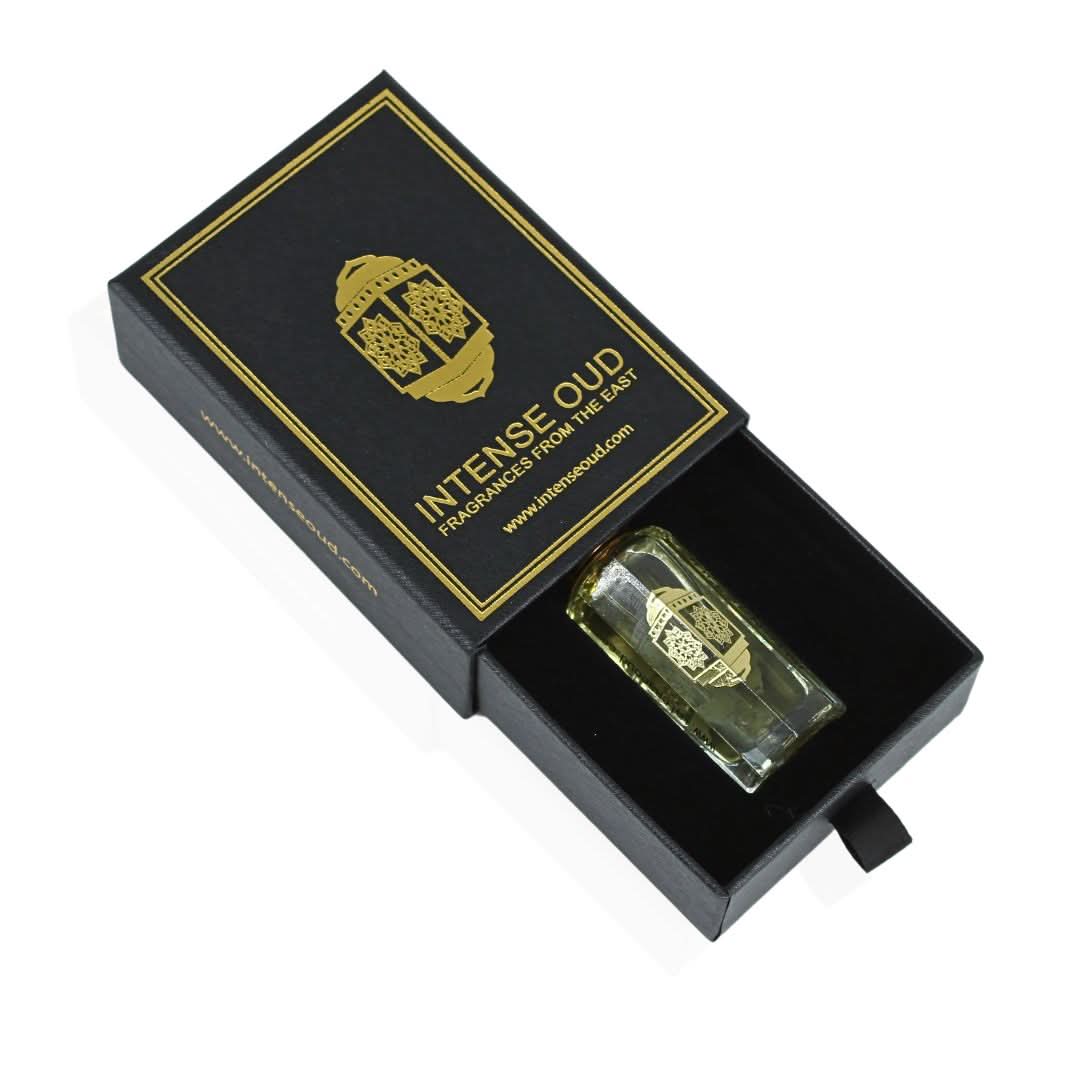 Intense Oud Attar Al Wardat perfume oil in 12ml bottle, shown with black gift box, featuring a clear glass bottle and elegant packaging.