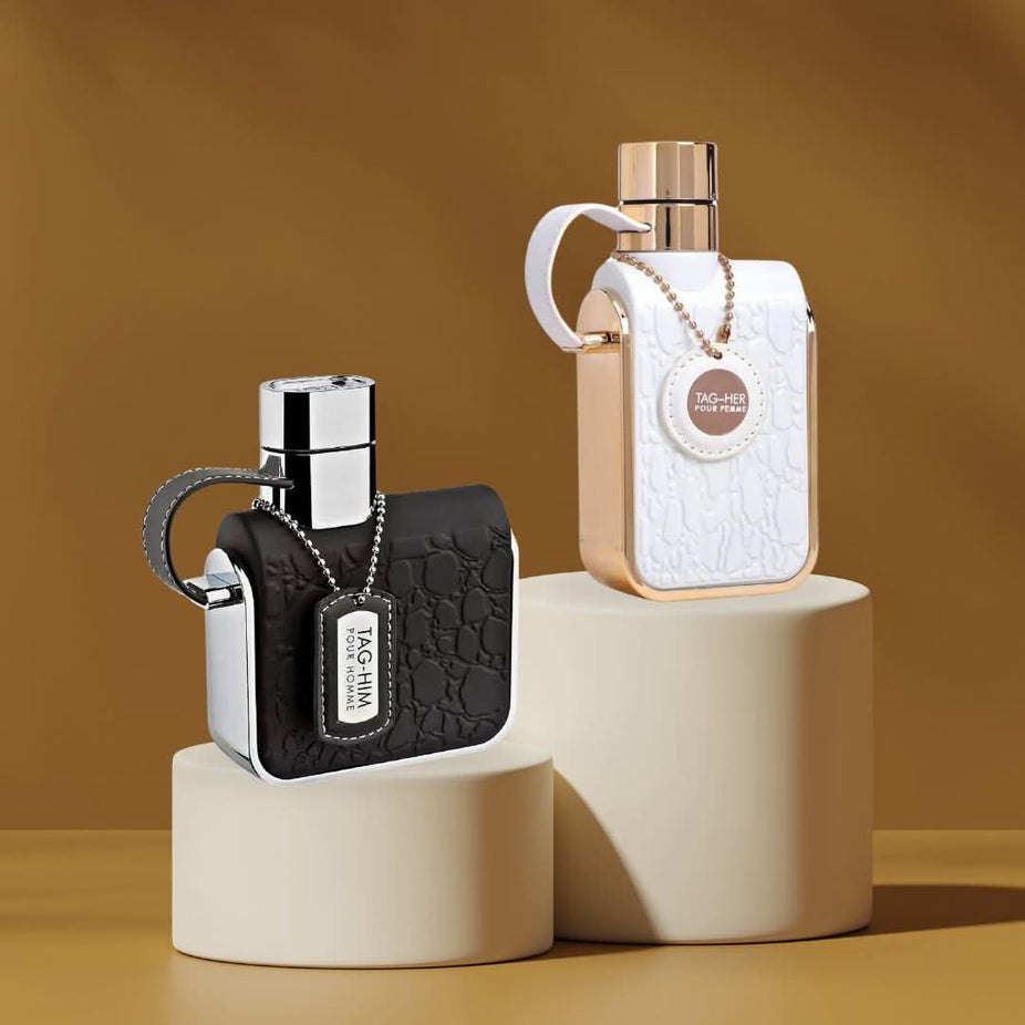 Armaf Tag Him & Tag Her Eau de Parfum bundle with two 100ml spray bottles, featuring sleek packaging for men and women.