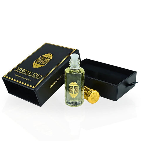 Musk Al Bakhoor perfume oil by Intense Oud in a 12ml bottle, displayed with a black gift box, showcasing the luxurious loose oil.