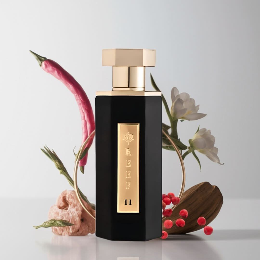 Reef 11 Eau de Parfum Spray 100ml by Reef Perfumes in velvet pouch, featuring sleek glass bottle with a modern fragrance design.