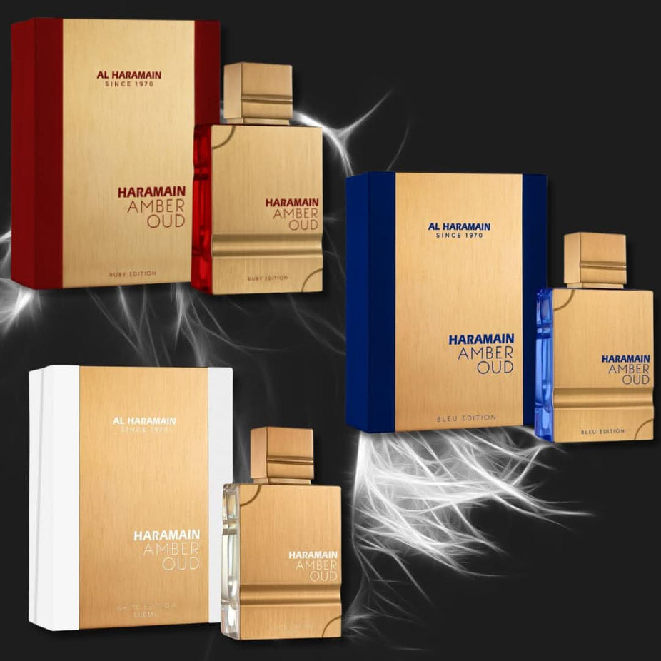 Al Haramain Amber Oud Eau De Parfum bottles in Ruby, Bleu, and White editions, 60ml, with elegant glass packaging and labels.
