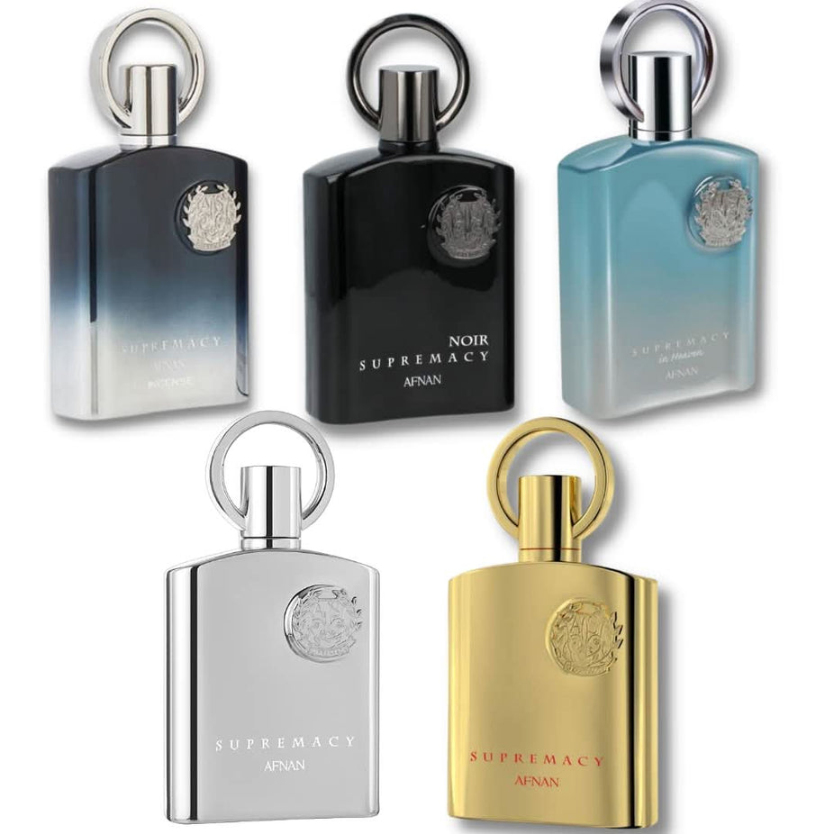 A collection of Afnan Supremacy Gold, Silver, Noir, Heaven, and Incense Eau de Parfum sprays in 100ml bottles, displayed together.