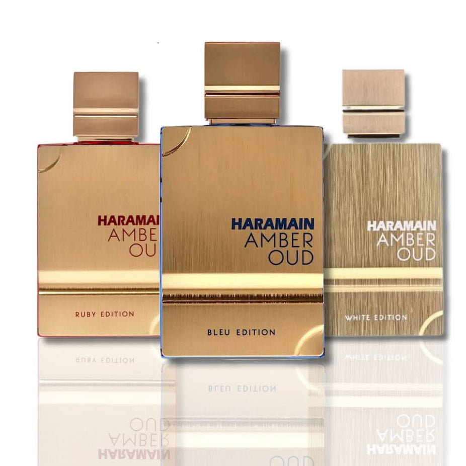 Al Haramain Amber Oud Eau De Parfum in Ruby, Bleu, and White editions, 60ml bottles with elegant packaging.