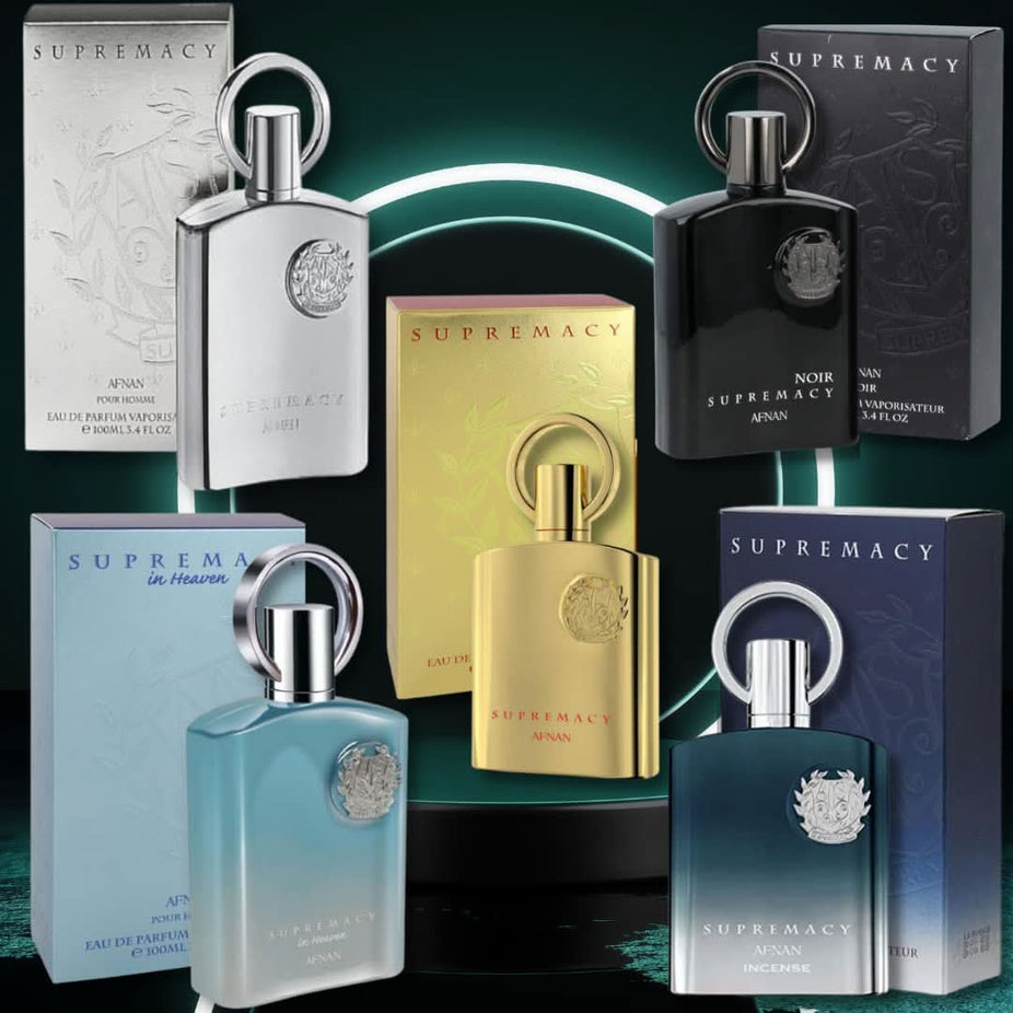 A collection of Afnan Supremacy Gold, Silver, Noir, Heaven, and Incense Eau de Parfum sprays in 100ml bottles, displayed together.