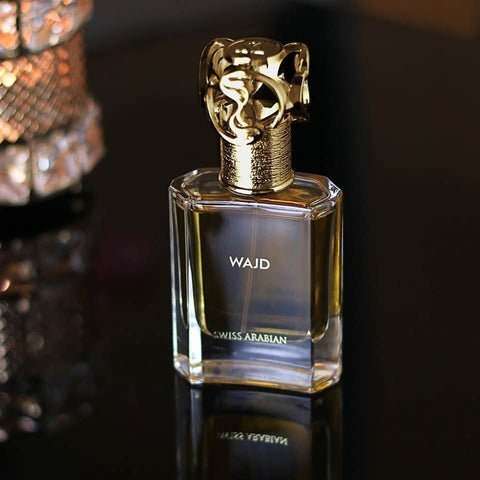 Swiss Arabian Wajd EDP 50ml bottle with velvet pouch, elegant fragrance packaging for Eau De Parfum.