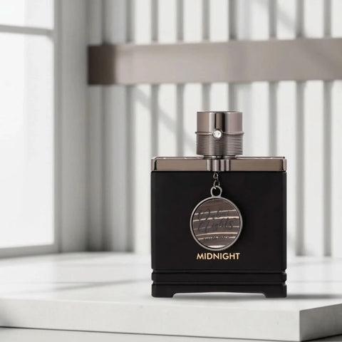 Dubai Nights Midnight Eau de Parfum spray by Armaf, 100ml, featuring black bottle with gold accents and elegant design.