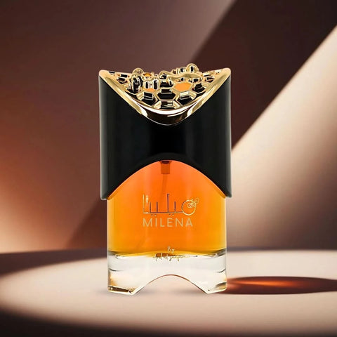 Milena Eau de Parfum Spray 100ml by Ard Al Zaafaran in a velvet pouch, featuring a sleek glass bottle with a decorative cap.