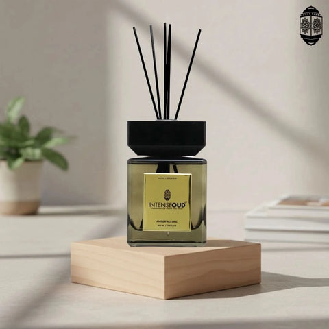 Intense Oud Amber Allure reed diffuser with six natural reed sticks in a glass holder, 500ml, reusable and refillable.