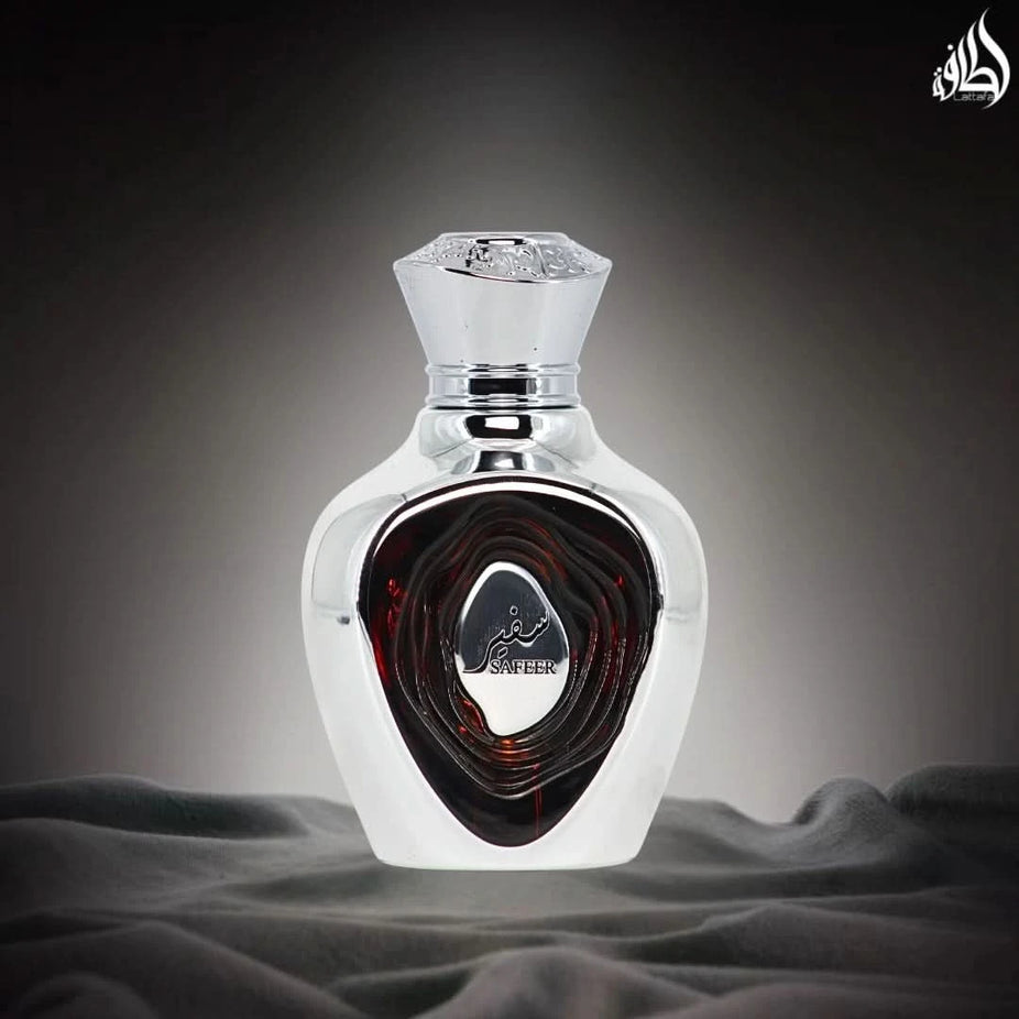 Lattafa Niche Emarati Safeer Eau De Parfum spray 100ml bottle, elegant glass container with gold accents.