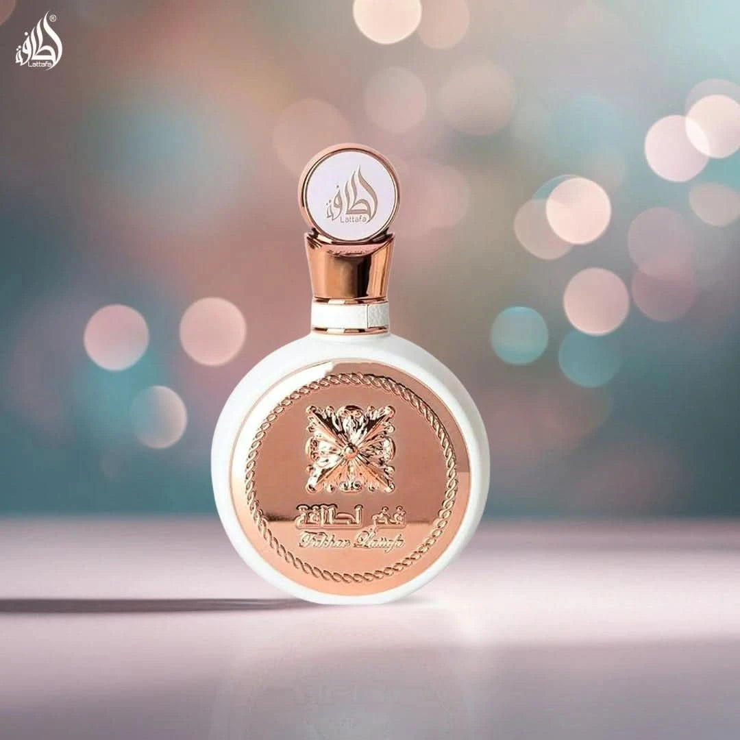 Lattafa Fakhar Women Eau de Parfum spray and all-over spray bundle, featuring 100ml and 150ml bottles with elegant packaging.