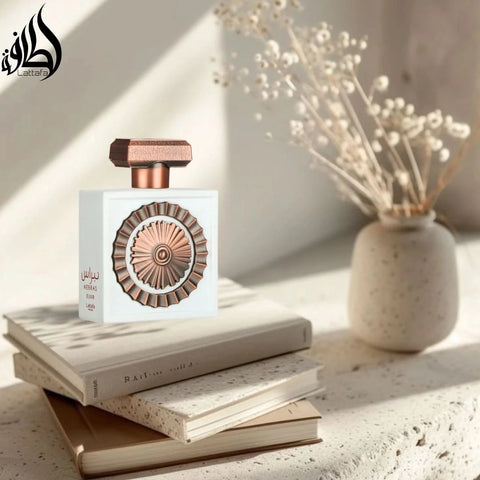 Lattafa Nebras Elixir Eau de Parfum spray 100ml with velvet pouch, showcasing the elegant perfume bottle and packaging.