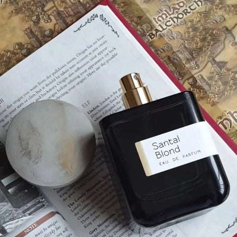 Atelier Materi Santal Blond Eau de Parfum spray bottle, 100ml, featuring a sleek design and warm, woody scent.