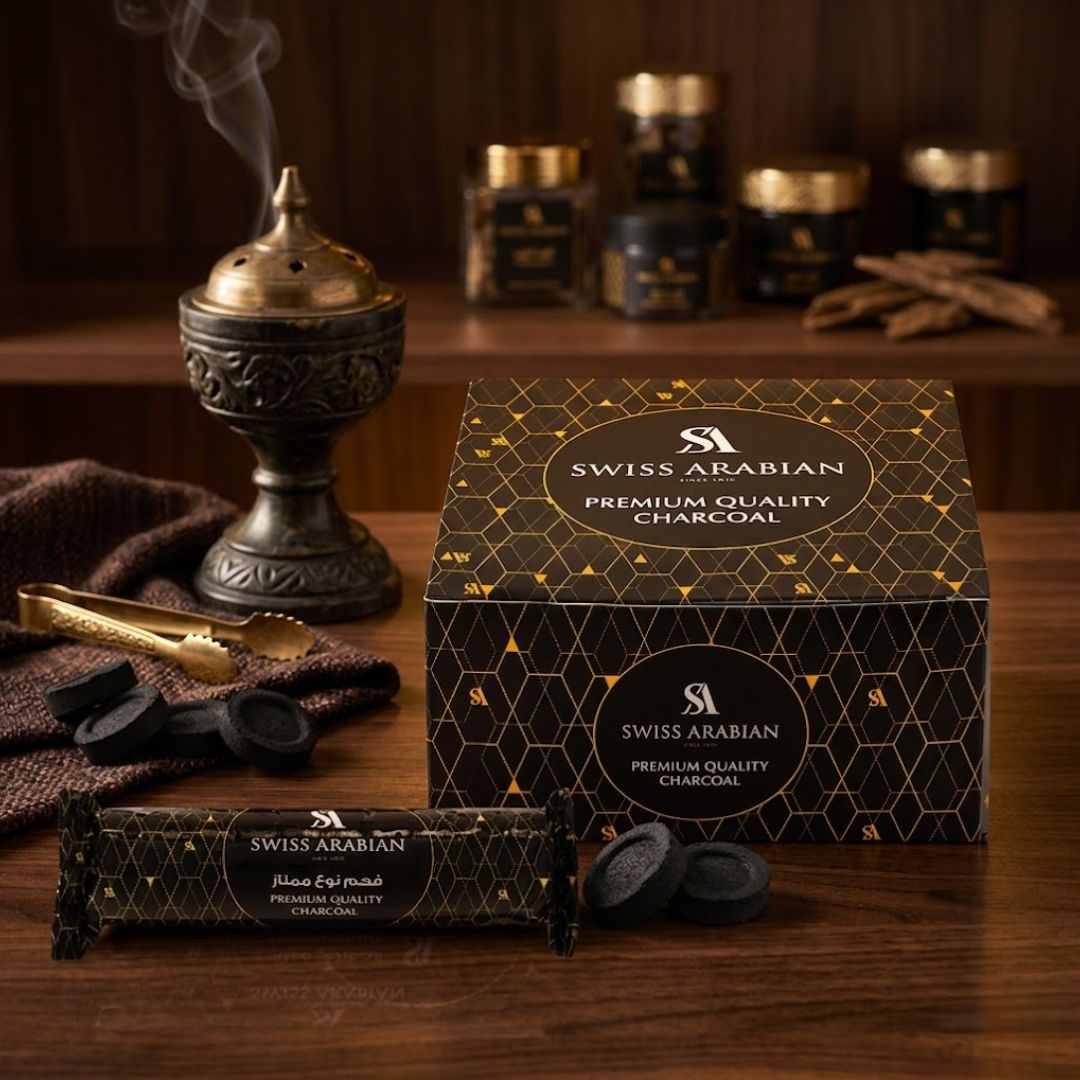 Swiss Arabian premium charcoal tablets, 80-count pack, shown in a close-up image of black, round charcoal tablets for aromatherapy or shisha.