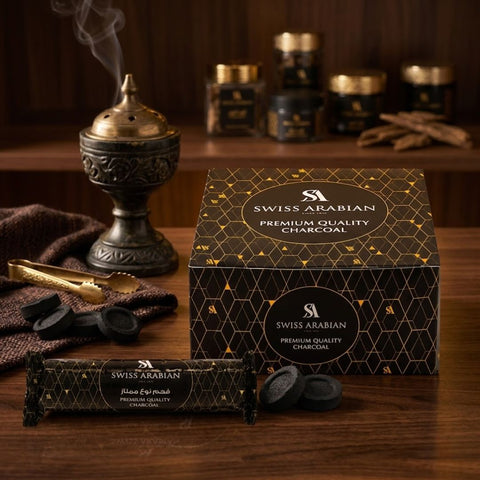 Swiss Arabian premium charcoal tablets, 80-count pack, shown in a close-up image of black, round charcoal tablets for aromatherapy or shisha.