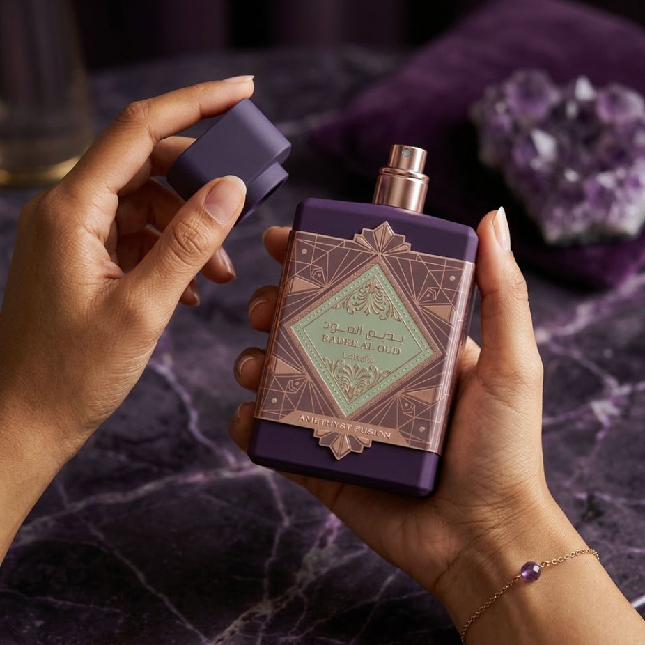 Lattafa Bade'e Al Oud Amethyst Fusion Eau de Parfum spray bottle, 100ml, with elegant purple packaging and floral accents.