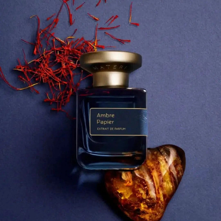 Atelier Materi Ambre Papier Extrait de Parfum spray 50ml, elegant perfume bottle with a sleek design and amber accents.