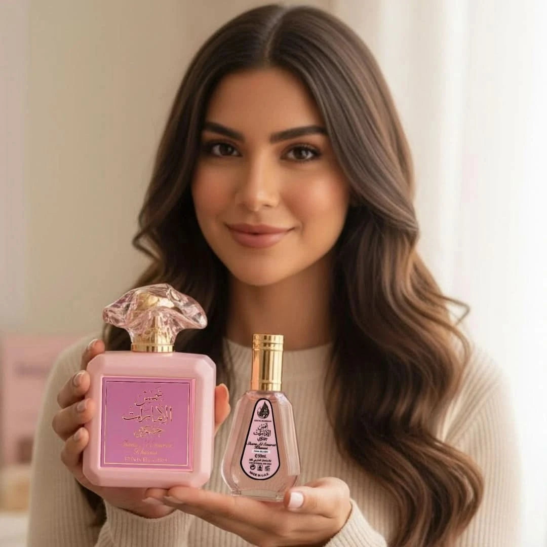 Pink Blush Shams Al Emarat Eau de Parfum by Ard Al Zaafaran in 100ml and 50ml bottles, featuring elegant perfume spray bottles.