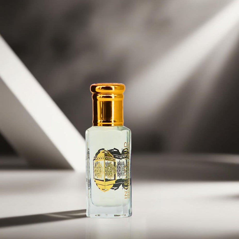 Inaya Perfume Oil 12ml by Intense Oud displayed in a sleek black gift box, showcasing the luxurious loose oil bottle.