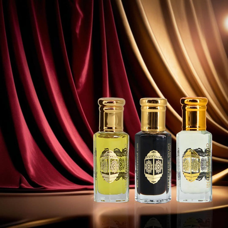 Bundle of Intense Oud Noble Fruits Bloom & Aphrodisiac perfume oils in 12ml bottles, displayed with black gift box.