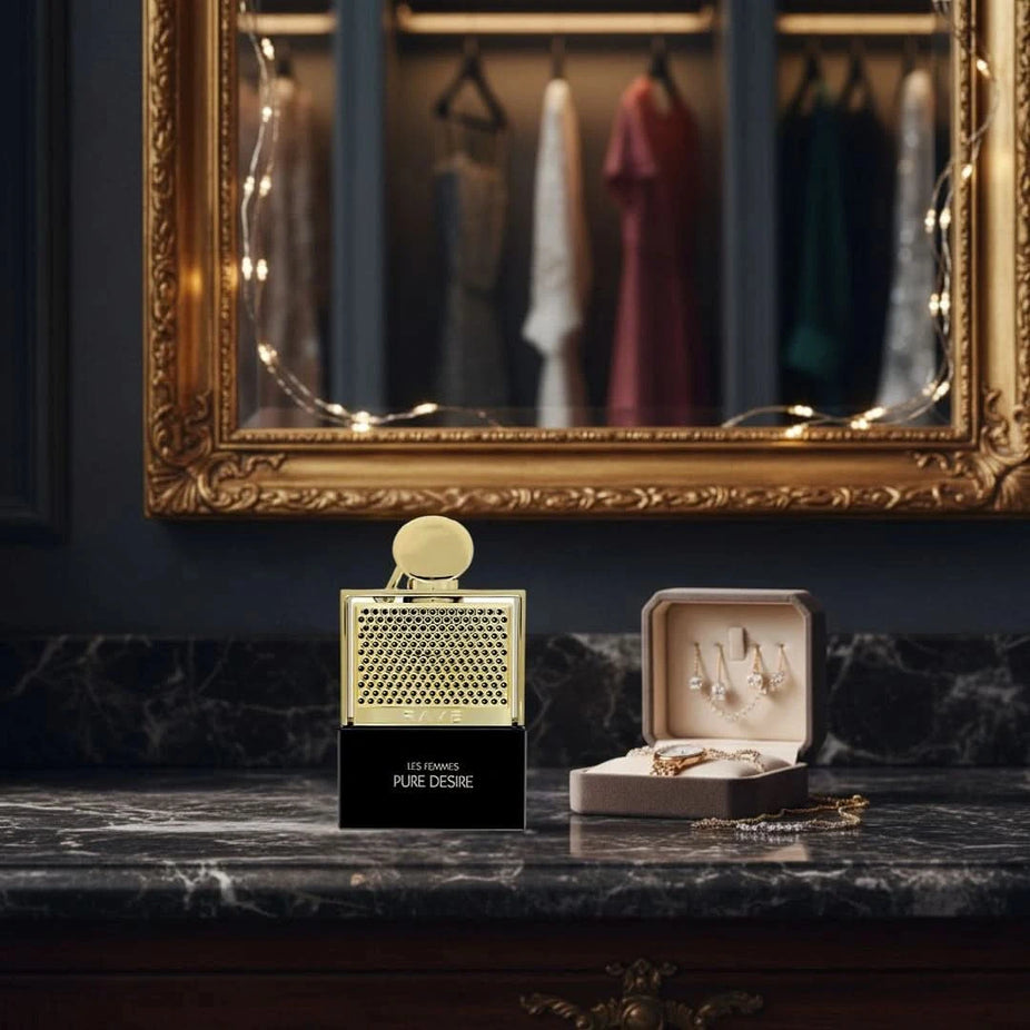 Pure Desire Gold Eau de Parfum Spray by RAVE, featuring a sleek 100ml bottle with elegant gold accents, showcasing luxurious fragrance.