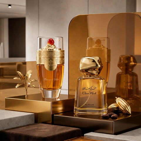 Bundle of Intense Oud Banana Bliss and Choco Musk Eau de Parfum sprays, 100ml each, featuring floral and fruity fragrance bottles.