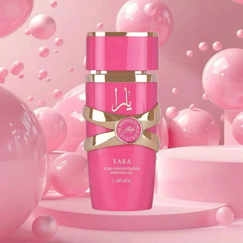 Lattafa Yara Candy concentrated perfume oil in 20ml bottle, displayed with velvet pouch and clear glass container.