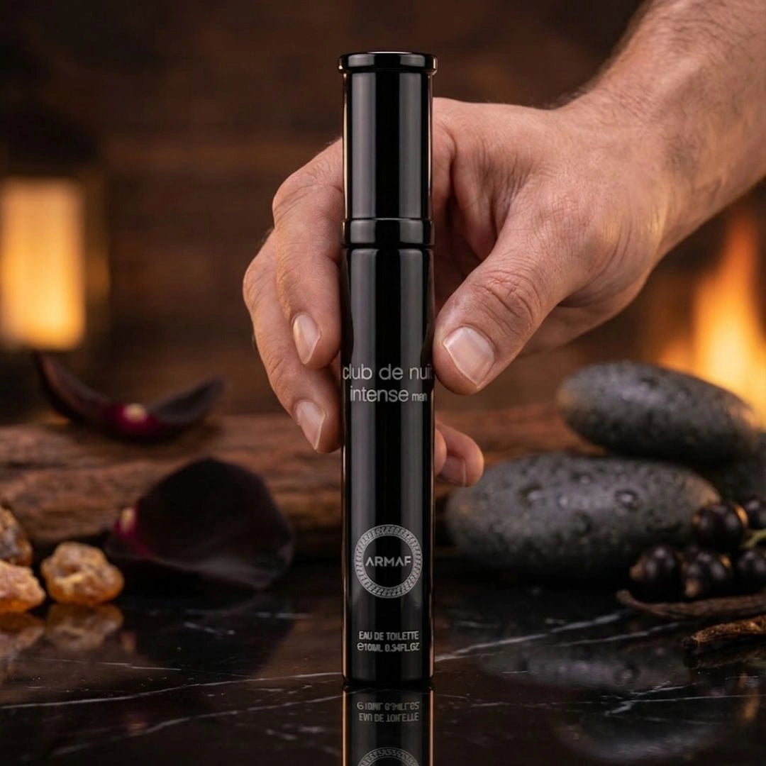 Travel size Armaf Club De Nuit Intense Man Eau de Toilette spray, 10ml, with sleek bottle design and fragrance cap.