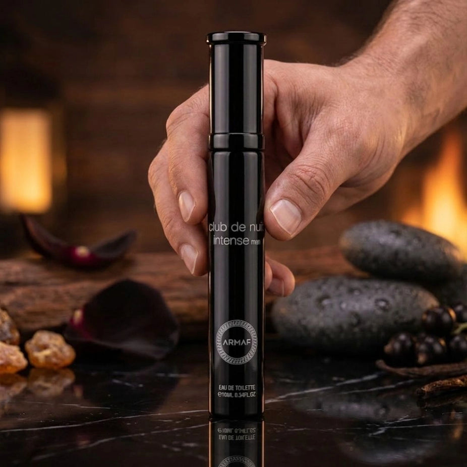Travel size Armaf Club De Nuit Intense Man Eau de Toilette spray, 10ml, with sleek bottle design and fragrance cap.