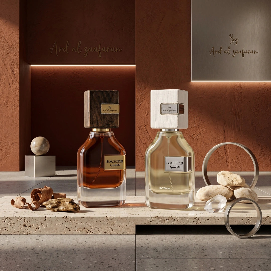 Bundle of Ard Al Zaafaran Saheb & Saheb Intense Eau de Parfum spray bottles, displaying elegant perfume packaging and bottles.