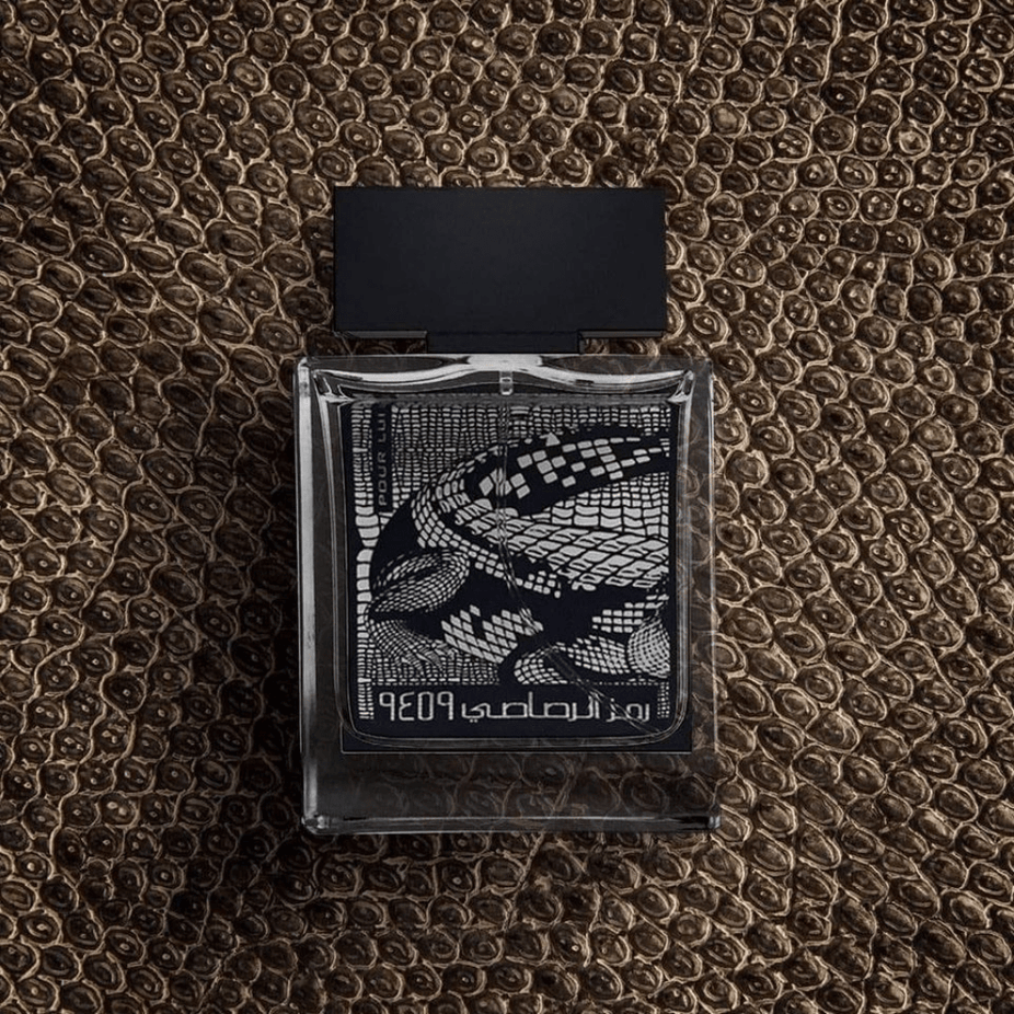 Rasasi Rumz Al Rasasi 9459 Alligator Pour Lui Men EDP 50ml with velvet pouch, showcasing the elegant fragrance bottle.