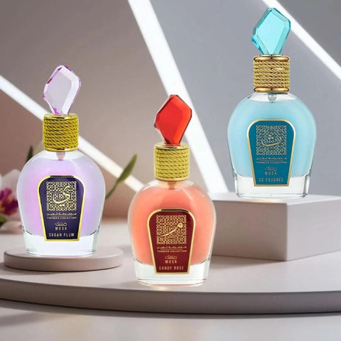 Bundle of Lattafa Candy Rose, Musk So Poudrée, and Sugar Plum Eau de Parfum sprays, 100ml bottles, with elegant packaging.