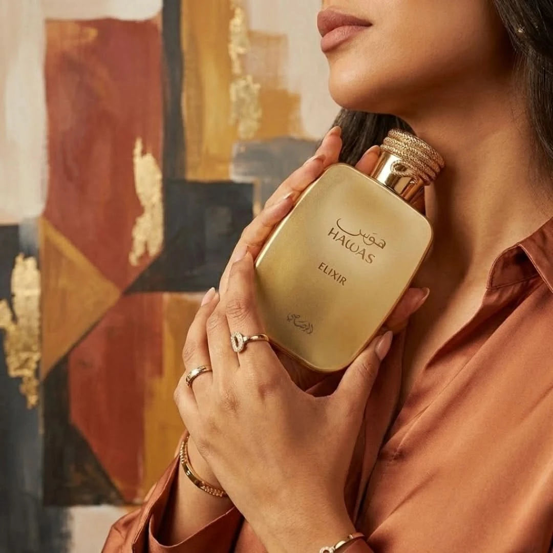 Rasasi Hawas Elixir Eau de Parfum spray bottle, 100ml, with elegant black and gold packaging, showcasing the perfume design.