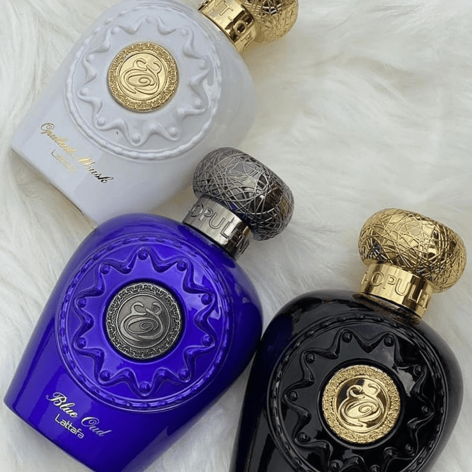 Blue Oud EDP by Lattafa, 100ML Eau De Parfum bottle with blue accents and elegant design, displayed against a neutral background.