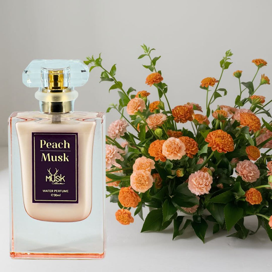 Hamidi Peach Musk Water Perfume spray 30ml bottle with elegant packaging and a soft, peachy musk scent.