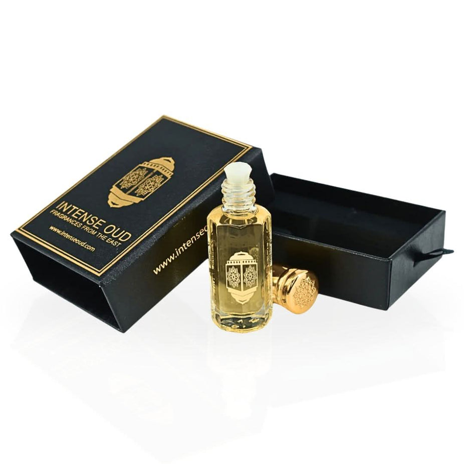 Intense Oud Touch Of Amber perfume oil in a 12ml bottle, displayed with a black gift box, showcasing a luxurious loose oil scent.