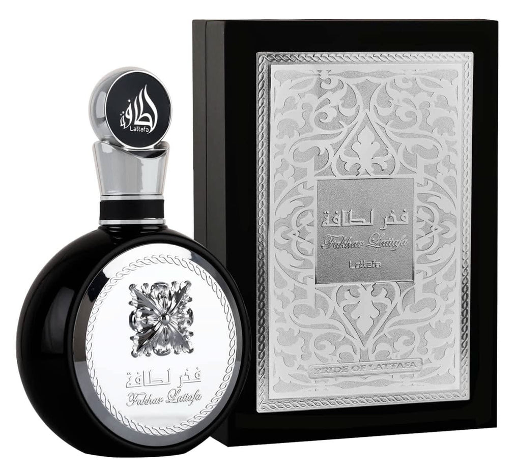 Lattafa Fakhar Men Ajwad & Oud Mood Elixir EDP perfume gift set with magnetic box, featuring two 100ml bottles of luxurious fragrances.