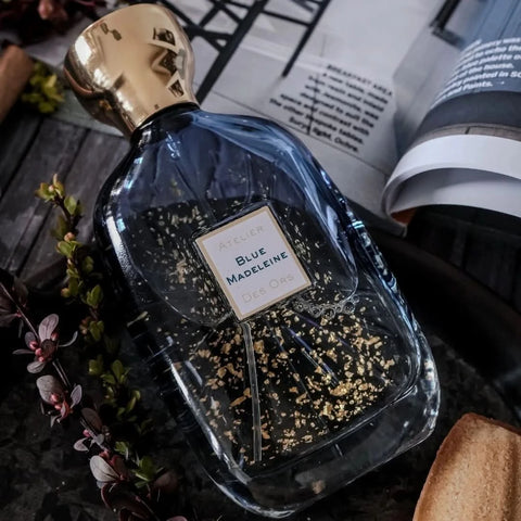 Blue Madeleine Eau de Parfum spray bottle by Atelier Des Ores, featuring a sleek blue design and elegant packaging.