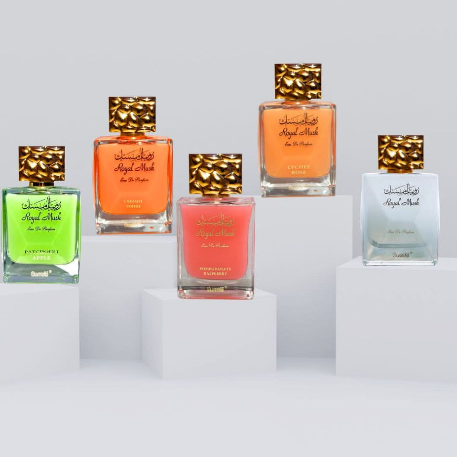 Surrati Royal Musk Eau de Parfum collection featuring Caramel Toffee, Patchouli Apple, Pomegranate Raspberry, Lychee Rose, and Musk sprays.
