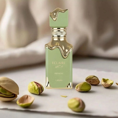 Lattafa Eclaire Pistache Eau de Parfum spray in a 100ml bottle, featuring a sleek design and velvet pouch.