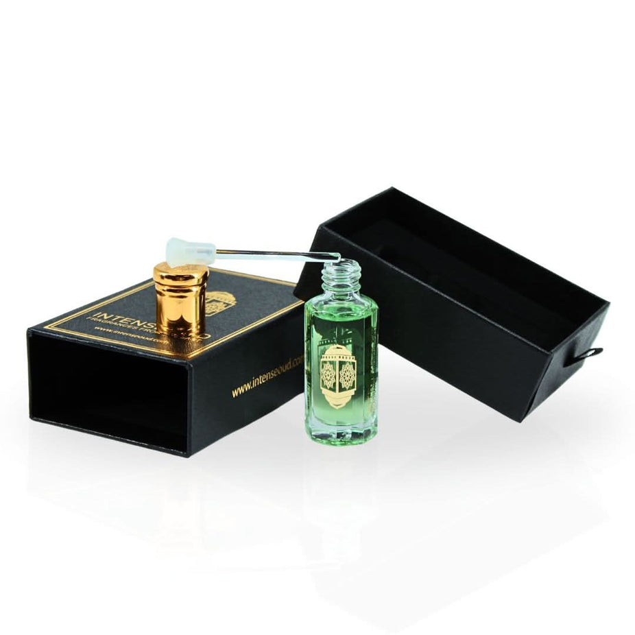 Intense Oud Fajr Perfume Oil 12ml with black gift box, featuring sleek, clear glass bottle of loose perfume oil.