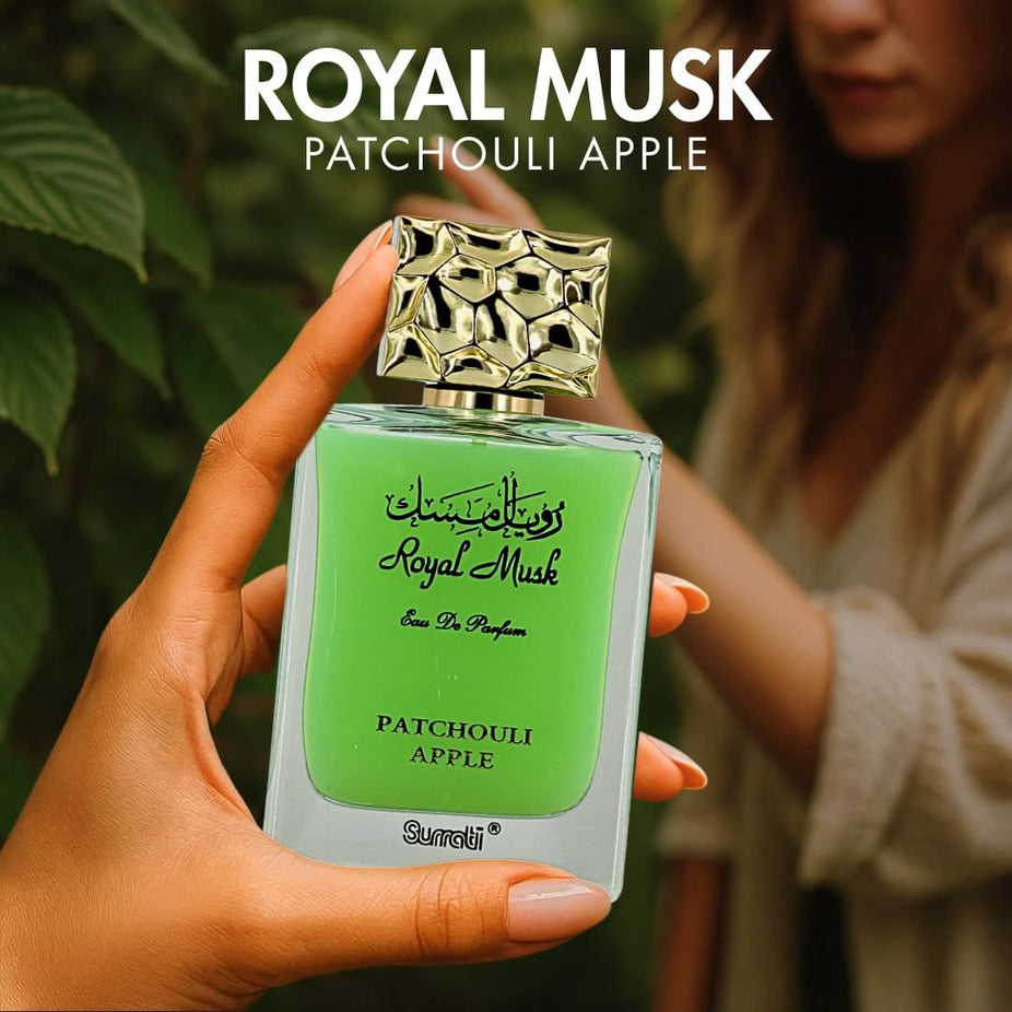 Surrati Royal Musk Patchouli Apple Eau de Parfum spray bottle with elegant packaging and floral accents, 100ml (3.4 oz).