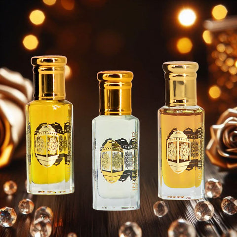 Bundle of Fawaken Crushed & Noble Fruits perfume oils by Intense Oud in 12ml bottles with black gift box, featuring colorful labels.