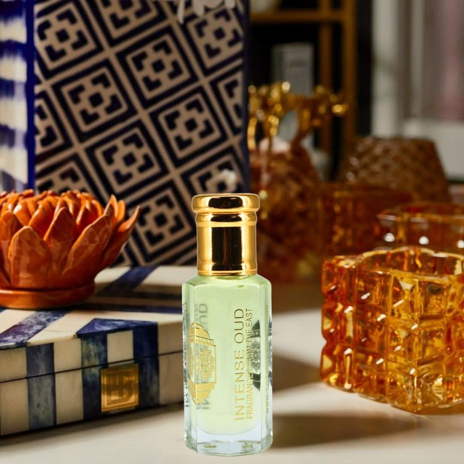 Rose Musk perfume oil by Intense Oud in 12ml bottle, displayed with elegant black gift box, showcasing the luxurious loose oil.